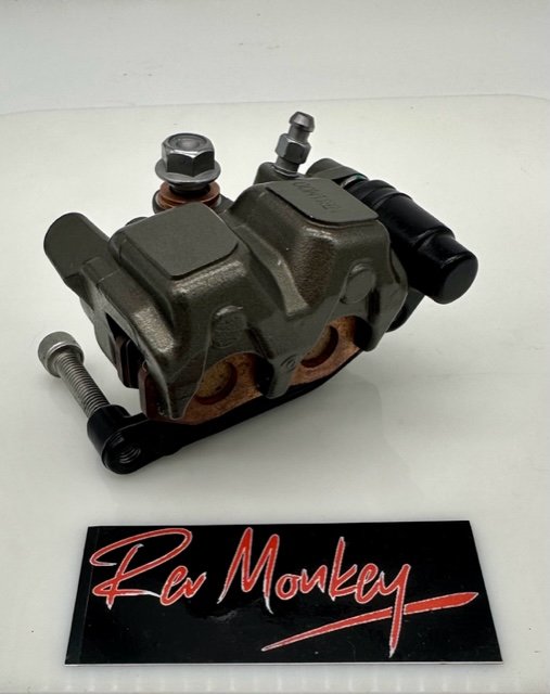 SURRON ULTRA BEE FRONT BRAKE CALIPER ASSEMBLY