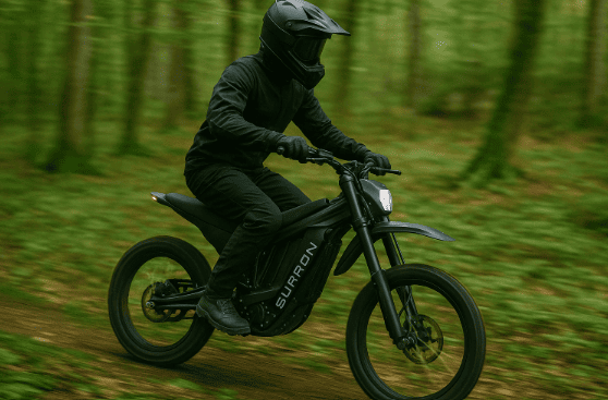 a biker riding through the forest on an electric bike
